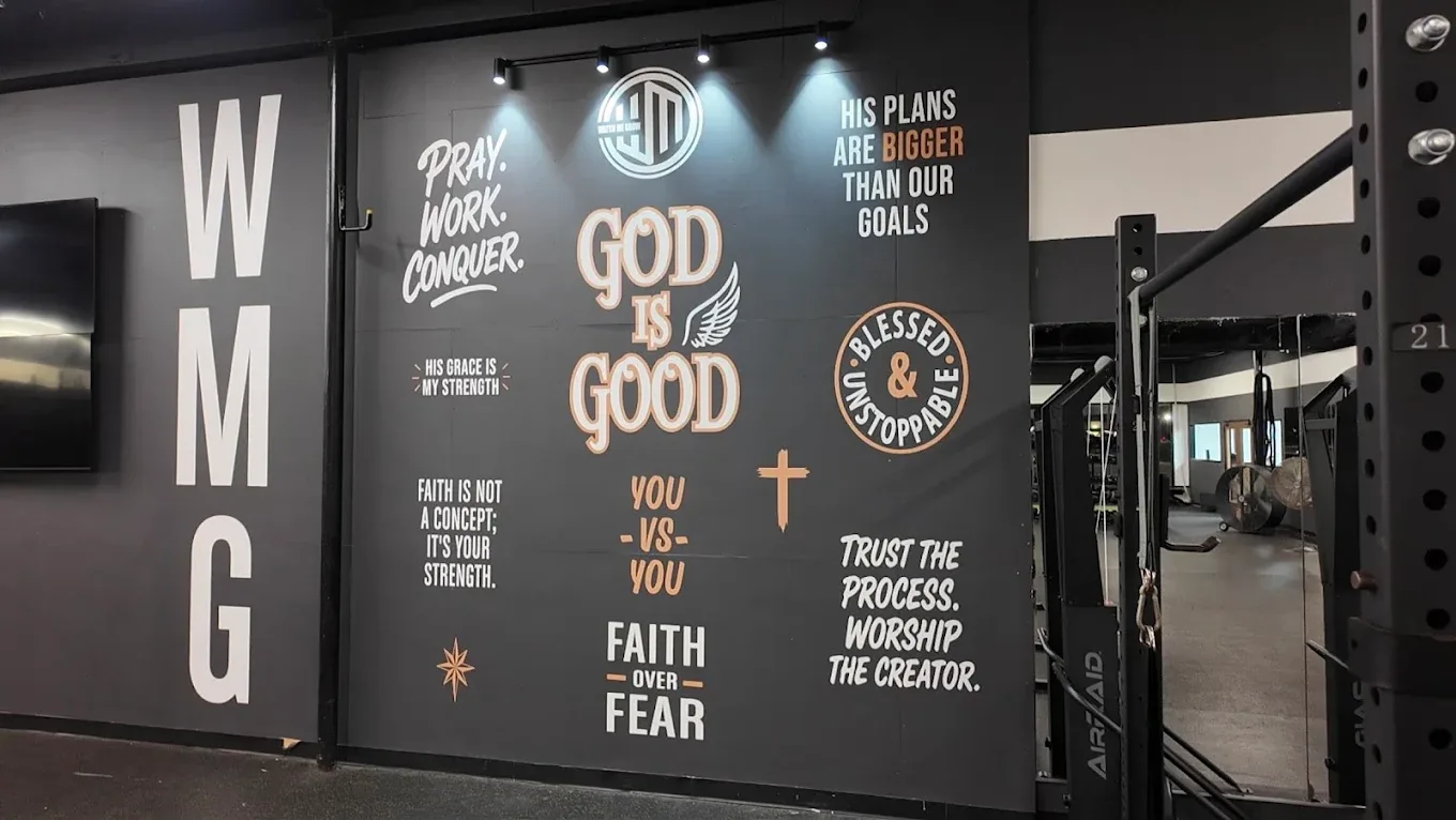 WMG Gym wall with faith murals and squat racks